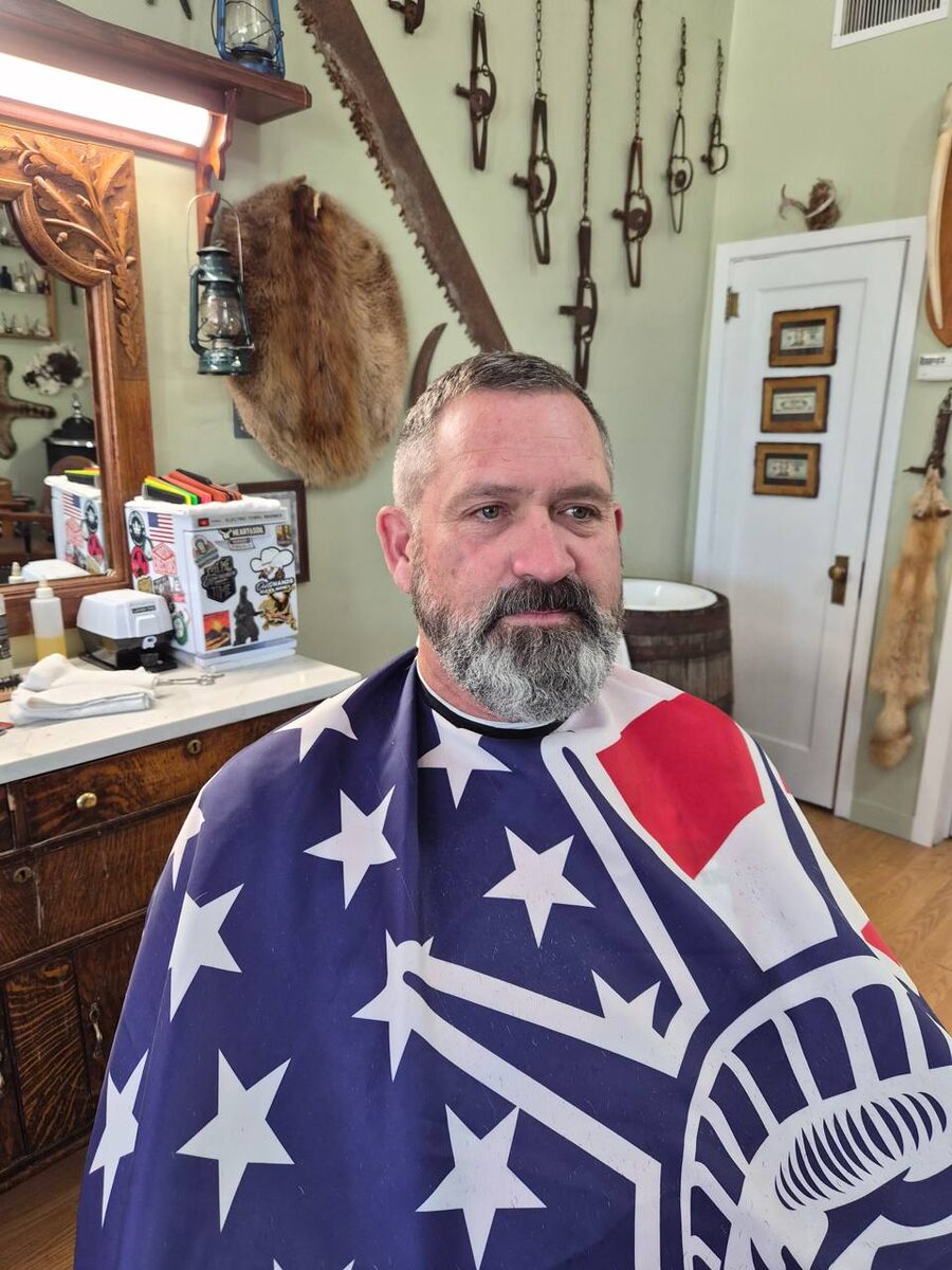 Man with full beard and trimmed haircut